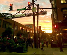 A photoof the sun setting over Ithaca Commons