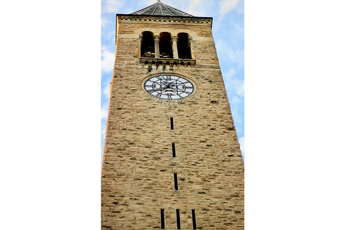 A photograph of the Clock Tower looking up from the base.