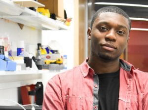 A photo of Cornell Engineering student, TseTse in a lab