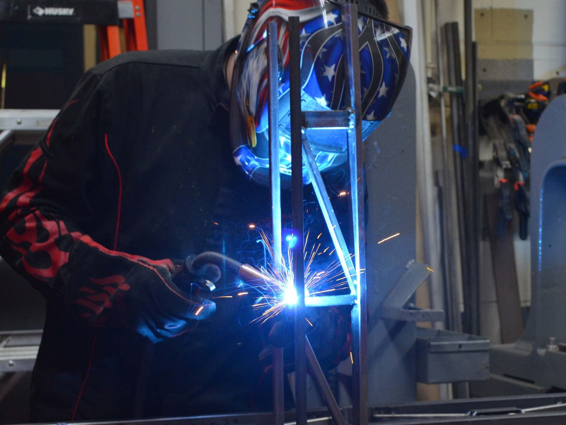 A photograph of a student welding